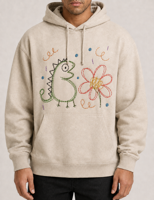 Organic cotton hoodie with a child's dinosaur and flower drawing embroidered on the chest