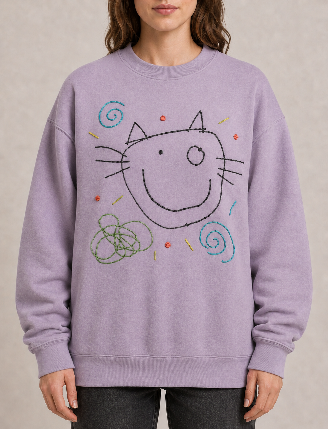 Lavender sweatshirt embroidered with a child's cat drawing